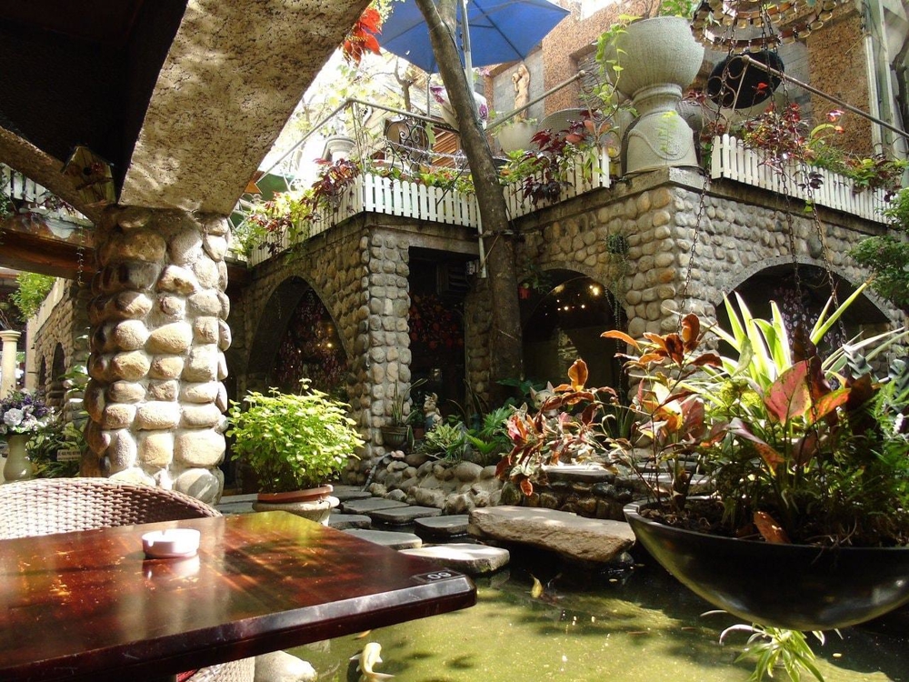 A hidden garden retreat with koi ponds and greenery